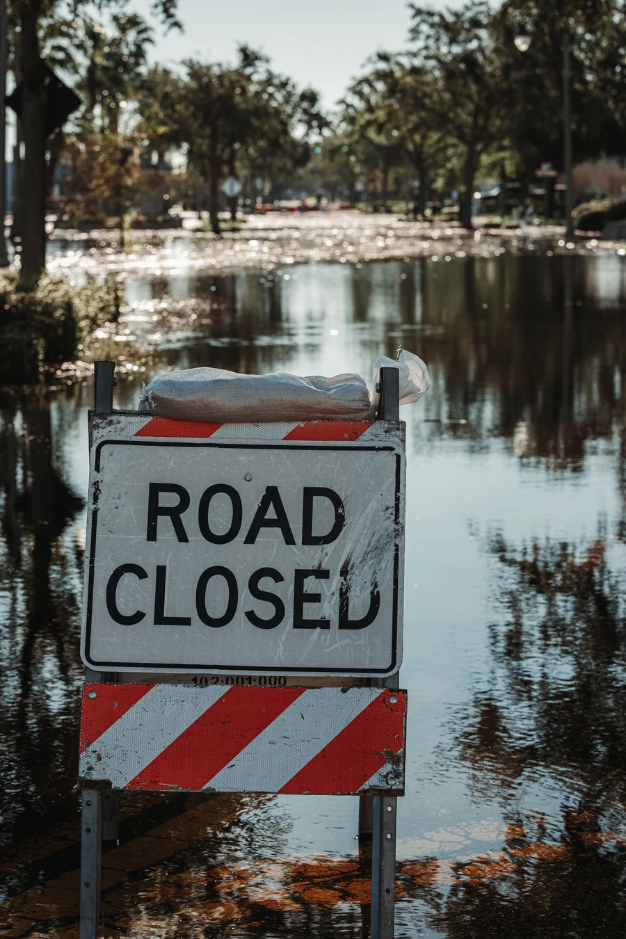 Road closed sign in a flooded street