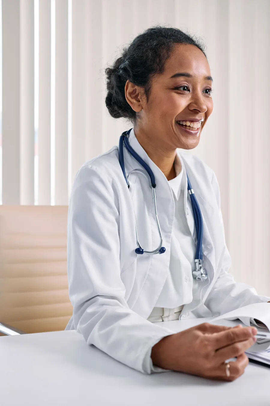 Smiling doctor in a bright clinic
